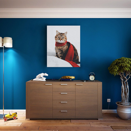 Kot w czerwonym szaliku na zimowym tle